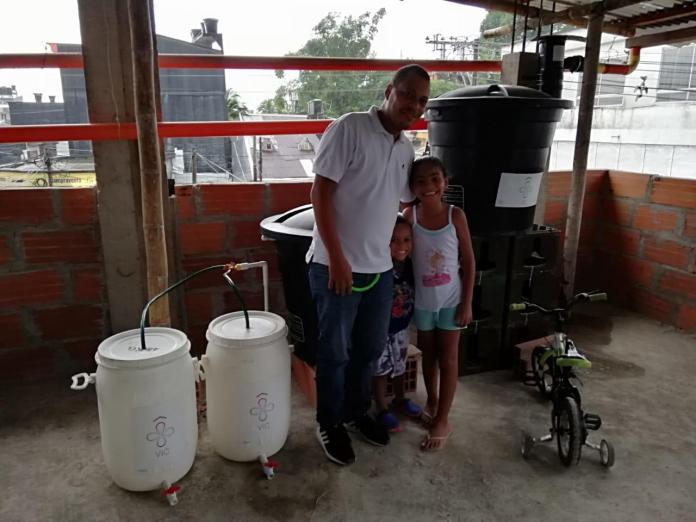 Environmental activist and head of Escuela Robótica de Chocó, Jimmy García with the water filters for rainwater harvesting.