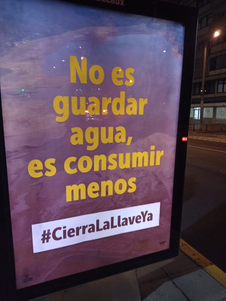 A billboard asking people to use less for water rationing in Bogotá, Colombia